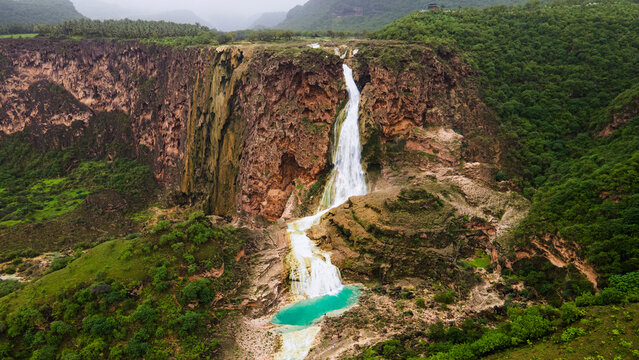 Wadi Darbat, Dhofar Governorate, south of the Sultanate of Oman, the beauty of the scenic green landscapes, tourist places, tourism in the Sultanate of Oman
