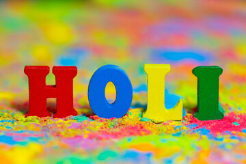 Happy Holi. Colorful background of multicolored gulal powder paints. A colorful festival of colored paints made from powder and dust. Celebration of bright colors of Indian tradition.