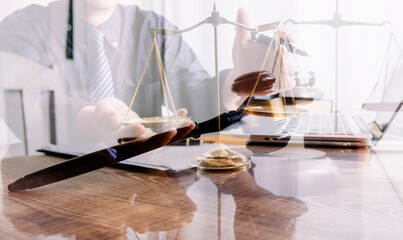 Male lawyer working with contract papers and wooden gavel on tabel in courtroom. justice and law ,attorney, court judge, concept.