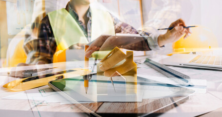 Architect or engineer working in office with blueprints,engineer inspection in workplace for architectural plan,sketching a construction project ,selective focus,Business construction concept.