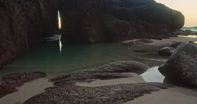 Rocky Coast With Zawn Pyg Rock Arch In Nanjizal Beach, Cornwall, UK - wide shot