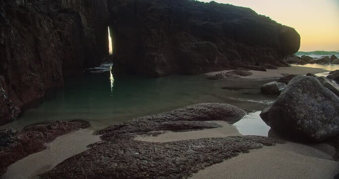 Zawn Pyg Natural Arch At Nanjizal Beach In Cornwall, England - wide shot