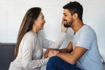 Portrait of happy multiethnic couple enjoying romantic moments together.
