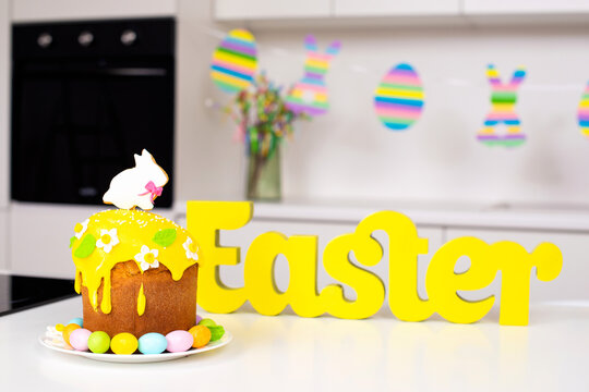 Easter cake with a rabbit and painted eggs on the table. Religious holiday