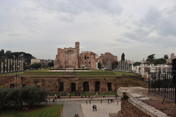 ROME, ITALY - February 05, 2022: Panoramic view of inside part of Colosseum in city of Rome, Italy. Cold and gray sky in the background. Macro photography of the arches.