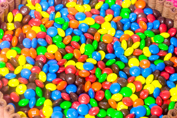 Fototapeta na wymiar inner view of a birthday cake filled with colorful m&m and other candies