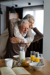 Elderly couple in love. Senior husband and wife hugging and bonding with true emotions