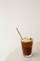 Glass of Cold Brew Coffee Lemonade With a Metallic Straw