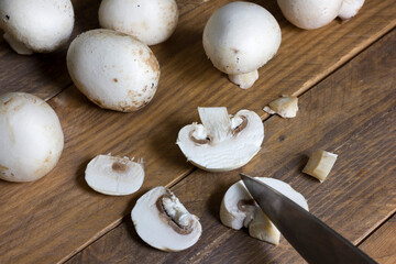 Agaricus bisporus mushrooms cut in slices. Vegan and healthy alignment.