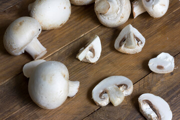 Top view of a group of white mushrooms Agaricus bisporus.