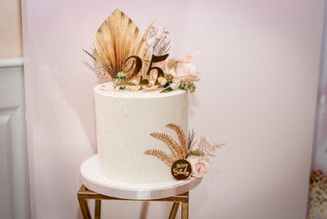 wedding cake decorated with flowers, desserts on the buffet, festive white cake