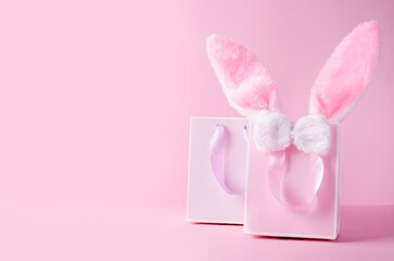 The concept of online stores for Easter, buying and selling for the holiday. Gift bag with hare ears