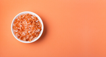 Fine-grained Himalayan pink salt and crystals in the wooden bowl