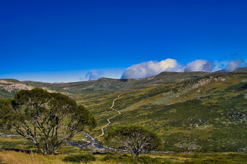 The Main Range Walking Track, crossing the Snowy River in the deep valley, in Kosciuszco National Park, New South Wales, Australia