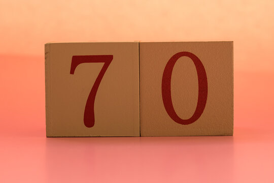 Numbers or dates on wooden cubes, seventy