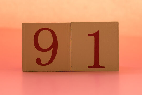Numbers or dates on wooden cubes, ninety-one