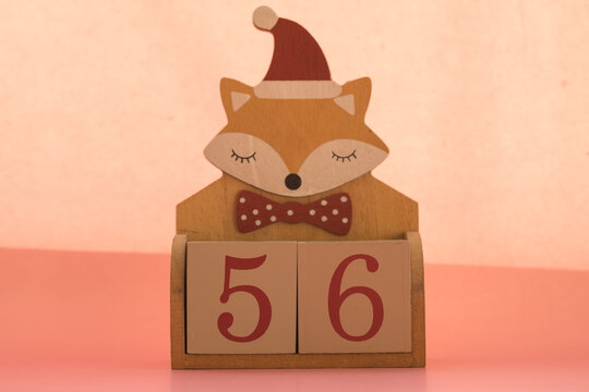Numbers or dates on wooden cubes with fox, fifty-six