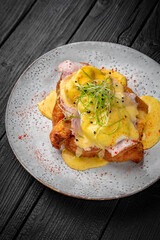 Croissant sandwich with chicken fillet, egg, ham and cheese. Healthy, tasty, nourishing snack. Take away food