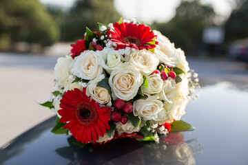 Bouquet of red and a white roses. Bride's bouquet . Close-up