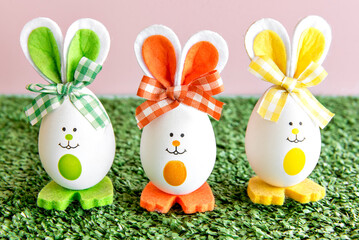 Decoration with easter eggs on grass background.