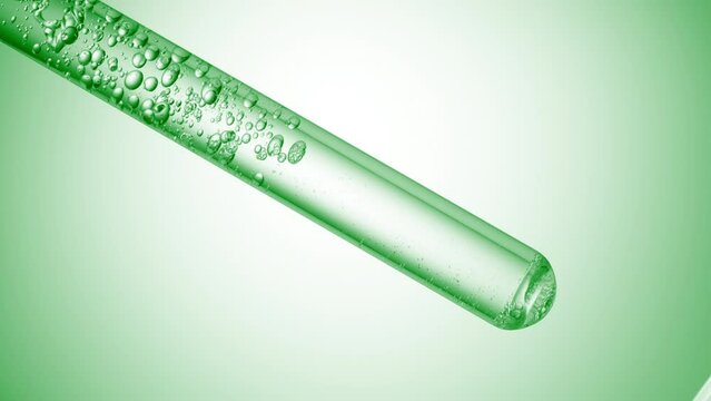 Citric acid is injected in test tube with clear liquid creating bubbles on green background | Abstract body care cosmetics with citric acid formulating concept