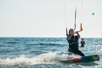 Woman kitesurfing on the ocean waters