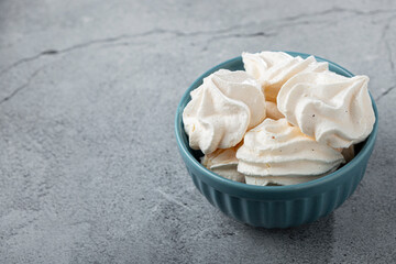 Delicious meringue cookies in the bowl.