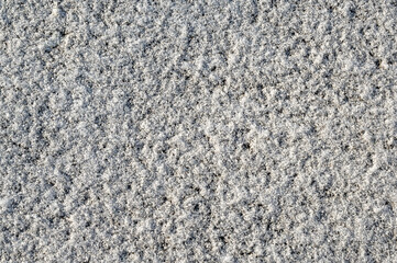 Snow texture, top view of the snow on asphalt. Texture for design