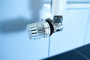 Thermostatic head from a heater. People heat up when it's cold. In many places, heating costs are...