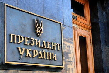 Sign on building with inscription in Ukrainian - President of Ukraine and coat of arms Ukraine in Kyiv . Residence of Ukrainian President on in Kiev city