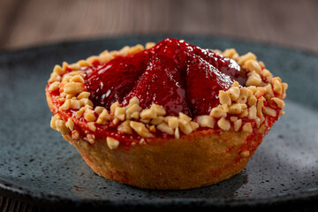 Delicious strawberry tartlet on the table.