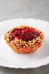 Delicious strawberry tartlet on the table.