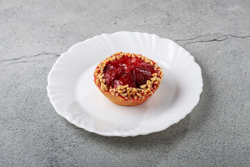 Delicious strawberry tartlet on the table.