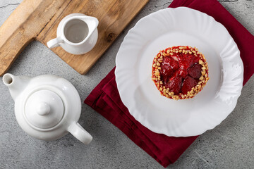 Delicious strawberry tartlet on the table.