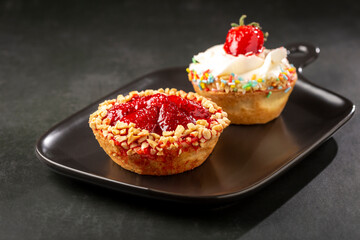 Delicious strawberry tartlet on the table.