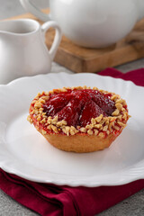Delicious strawberry tartlet on the table.