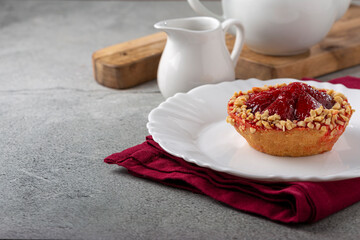Delicious strawberry tartlet on the table.