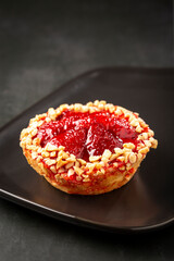Delicious strawberry tartlet on the table.