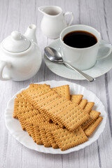 Plate with cornstarch biscuit on the table.