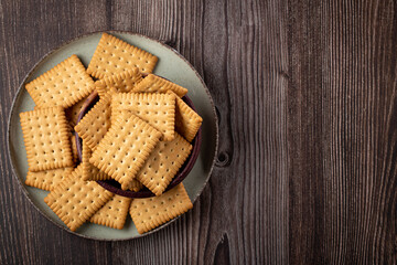 Plate with cornstarch biscuit on the table.