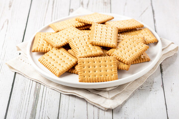 Plate with cornstarch biscuit on the table.