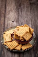 Plate with cornstarch biscuit on the table.