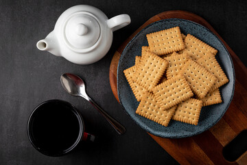Plate with cornstarch biscuit on the table.