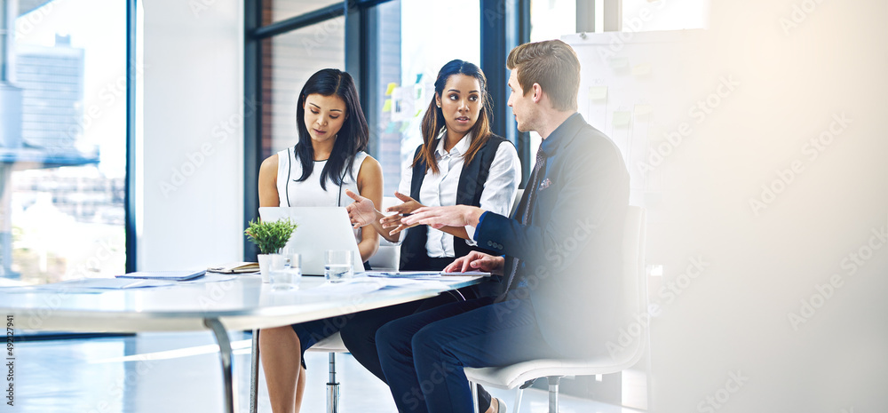 Poster exchanging ideas to get the best result. cropped shot of a group of young businesspeople having a di
