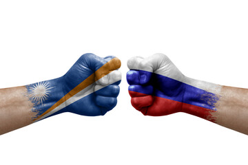 Two hands punch to each others on white background. Country flags painted fists, conflict crisis concept between marshall islands and russia
