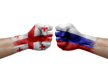 Two hands punch to each others on white background. Country flags painted fists, conflict crisis concept between georgia and russia