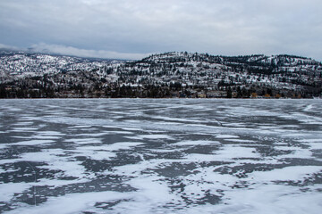 frozen lake in winter in the mountains