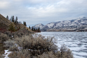 frozen lake in winter in the mountains