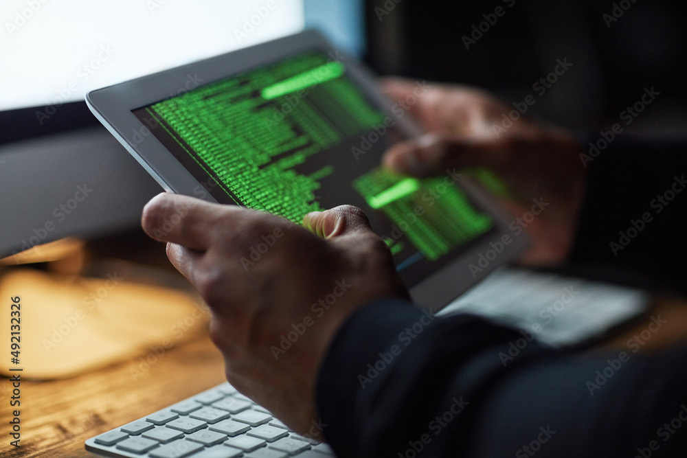 Aufkleber No system is uncrackable. Cropped shot of an unidentifiable hacker cracking a computer code in the dark.