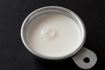 Half and Half Cream in a  Measuring Cup
